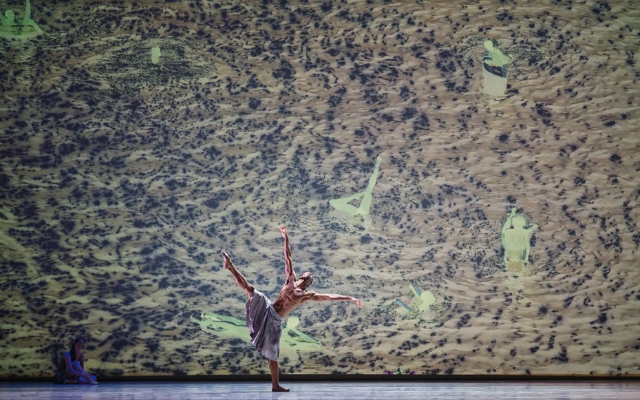 Joshua Francique performs in ‘Let Not Your Heart Be Troubled.’ Photo by Jamie Lyons. Visuals by Richard Misrach